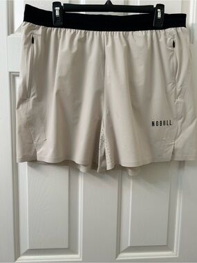 NOBULL Men's Light Cream Training Shorts with Black Waistband